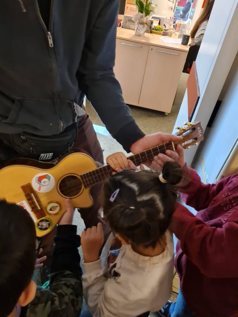 Children gathered around the road uke in Istanbul